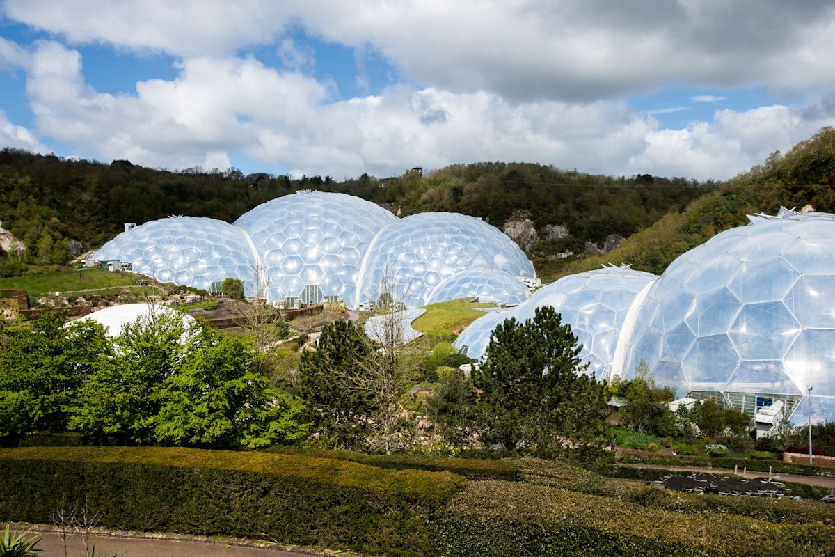 a photo of the eden project biomes which are like huge clear domes made up of hexagons